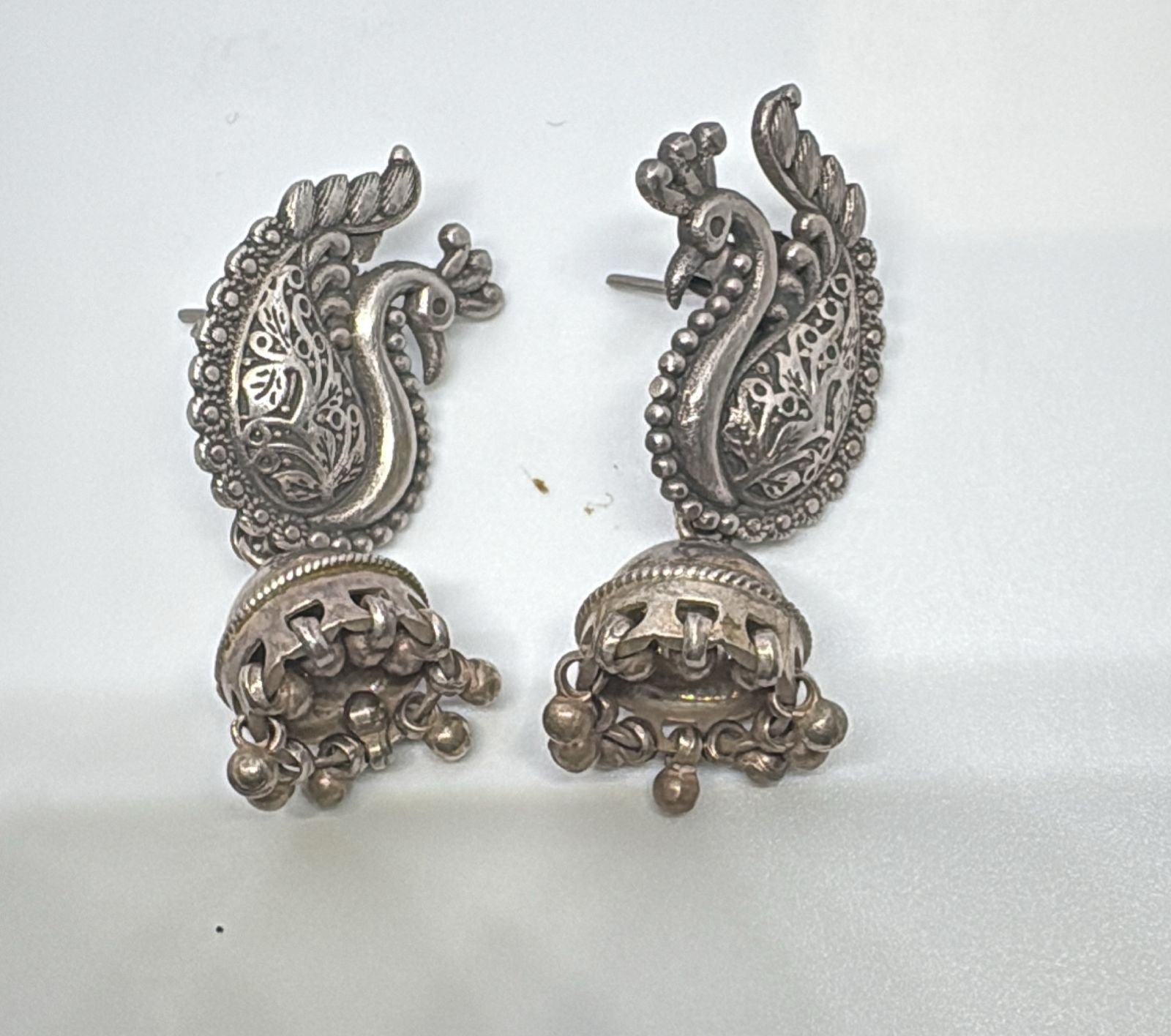silver with peacock design